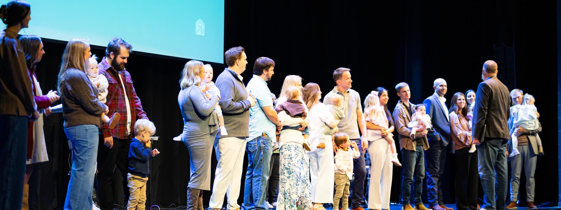 Families on stage during a Rise Church child dedication